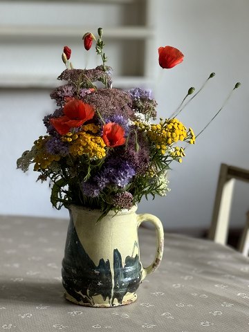 Antique French Jaspé pitcher made of earthenware with a marbled glaze.